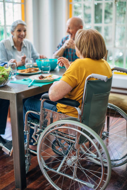 istock Seniors having meal in their retirement home 1196168849