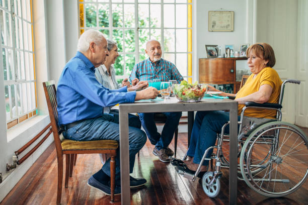 istock Seniors having meal in their retirement home 1196168855