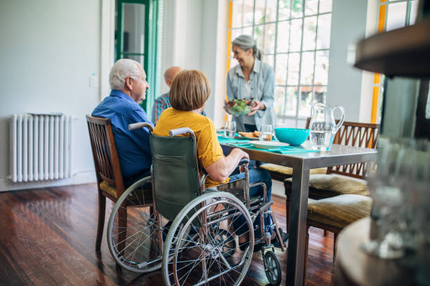 istock Seniors having meal in their retirement home 1196169406