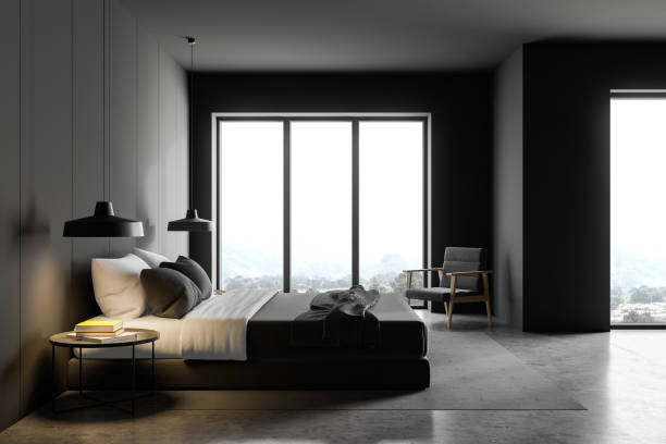 istock Gray master bedroom with armchair, side view 1196169560