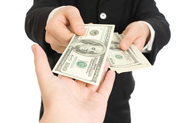 Money in human hands stock photo