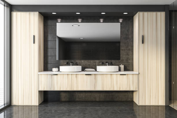 istock Double sink in gray tile bathroom 1196170567