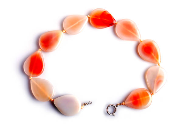 agate colored beads isolated on white background. top view, close up.