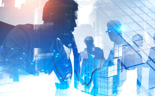 istock Thoughtful broker and team in modern city. Graphs 1196170833