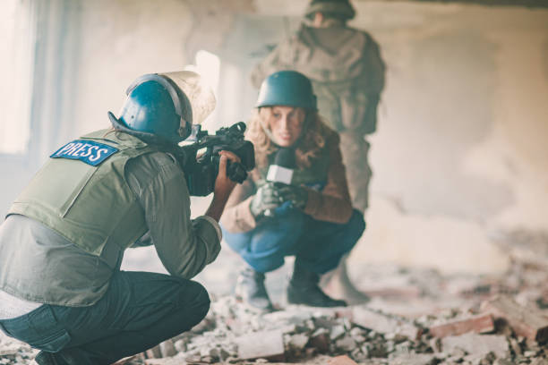 istock Two journalists in the war zone 1196170851
