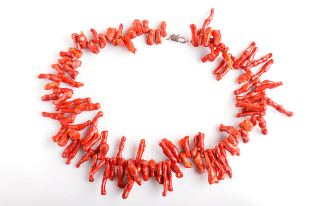 red coral beads isolated on white background. top view, close up.