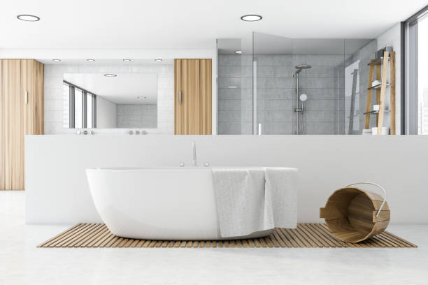 istock Spacious white tile bathroom with bathtub 1196171444