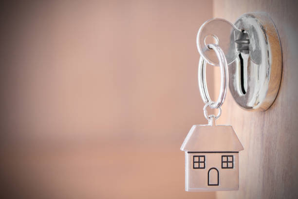 istock House key in the door 1196172541