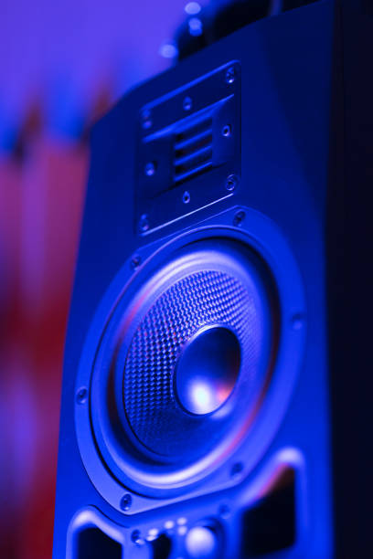 Music loudspeaker sound system in neon blue light Music loudspeaker sound system in neon blue light. Dynamic monitor in studio close-up home recording studio setup stock pictures, royalty-free photos & images