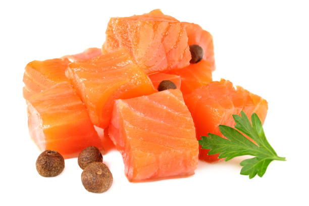 istock Red fish. Raw salmon fillet with parsley and peppercorns isolate on white background 1196177874