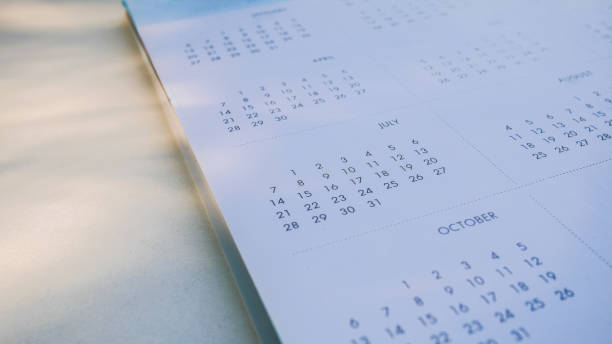 istock Blurred calendar in dark tone in planning concept. 1196178858