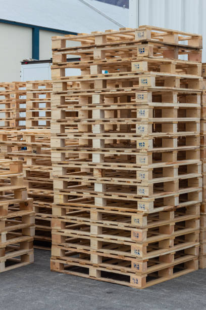 istock Many pallets stacked in stock, warehouse pallets 1196180427