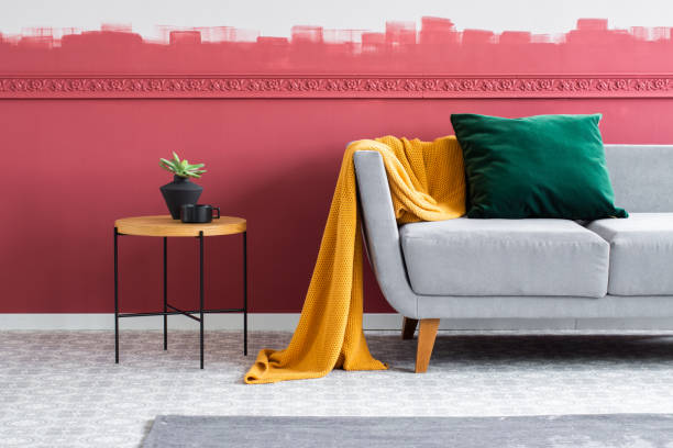 istock Elegant and modern living room interior with grey sofa with pillows and coffee table 1196186410