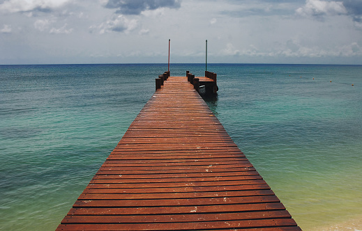 A wooden jetty reaching out to sea
