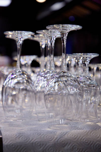 istock Empty glasses stand in a restaurant in front of a banquet 1196208247