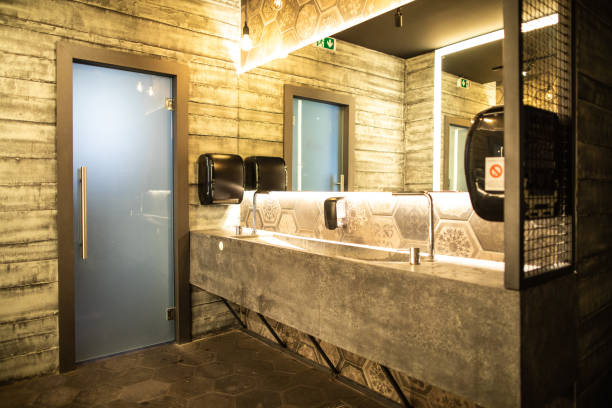 Luxurious public restroom in restaurant Luxurious bathroom in restaurant, with mirrors, door, hand dryer restaurant mirror stock pictures, royalty-free photos & images