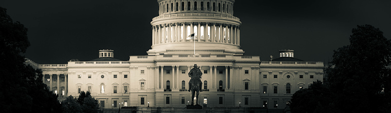 Panorama of the Capitol of the Unites States in evening light with the statue of President Grant in the foreground.
