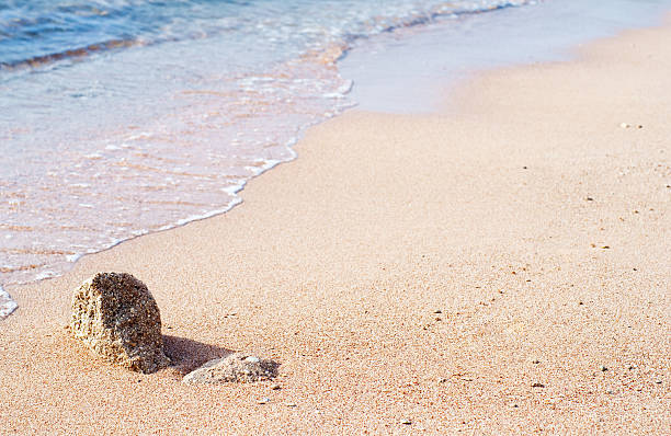 ocean waves on sand stock photo