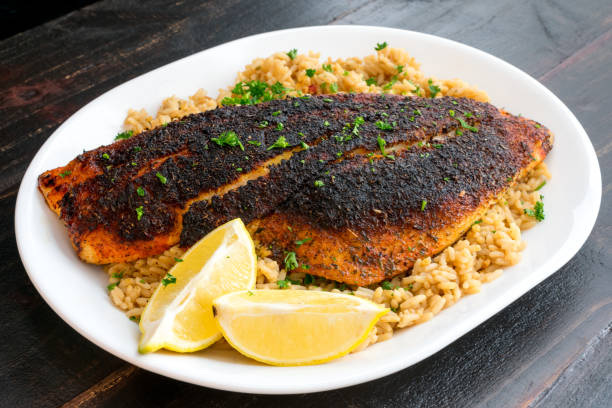 istock Cajun-style Blackened Red Snapper on Dirty Rice 1196221996