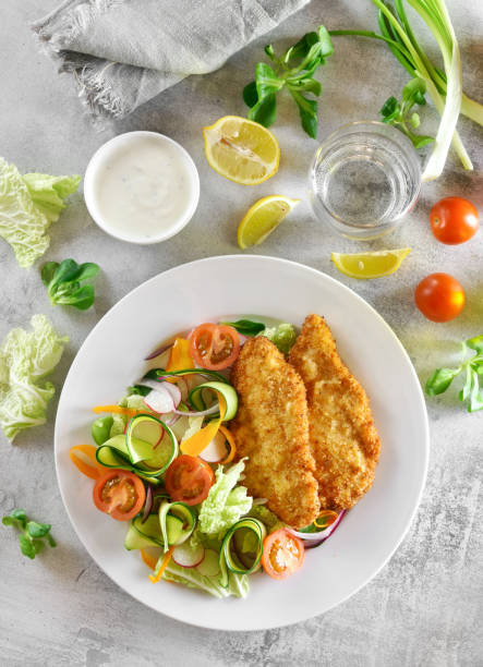 istock Fresh vegetable salad and breaded chicken breast 1196222451