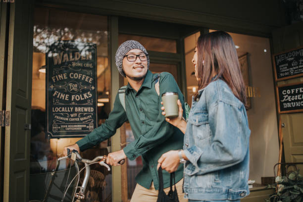 Go green with hipster couple at the coffee shop before working reusable, cup, cafe, coffee shop, couple, smiling, talking, lifestyles, Bangkok, Thailand hipster bike stock pictures, royalty-free photos & images