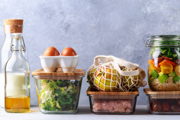 istock Glass boxes and cans with fresh food refrigerator storage concept decanting 1196234855