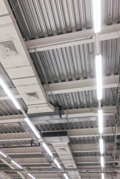 istock Ceiling in shopping center with ventilation, ducts and lamps 1196235716
