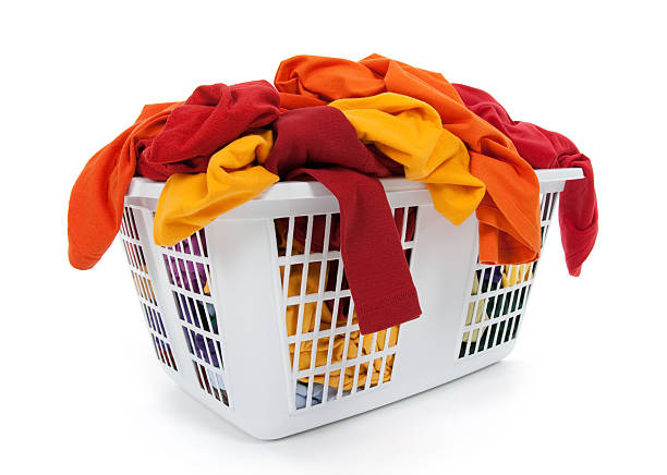 istock Bright clothes in laundry basket. Red, orange, yellow. 119623880