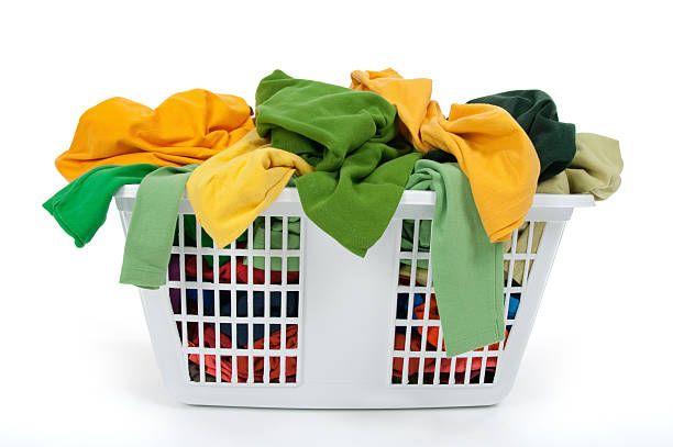 istock Colorful clothes in laundry basket. Green, yellow. 119623885