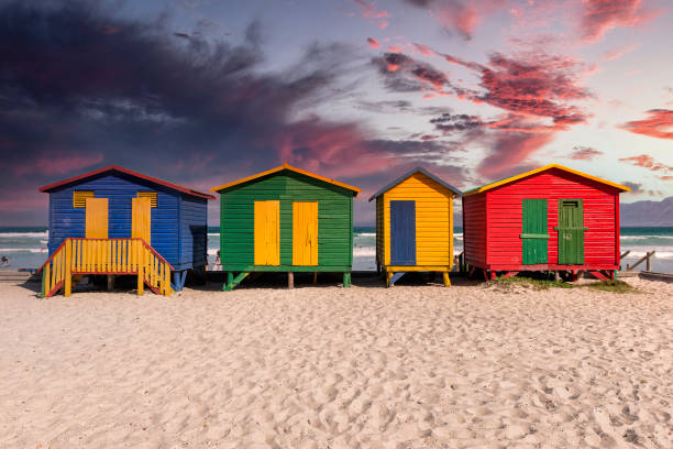 istock Beach Huts at Sunset with Red Sky Background 1196240515