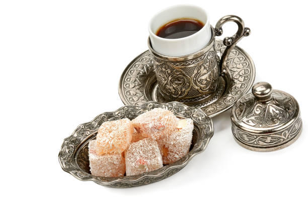 istock Aromatic black coffee in a stylish cup and Turkish delight isolated on a white background. 1196241643