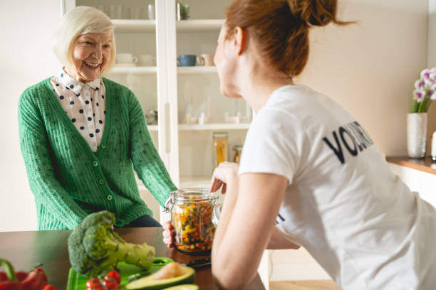 istock Positive delighted mature female having friendly conversation 1196243676