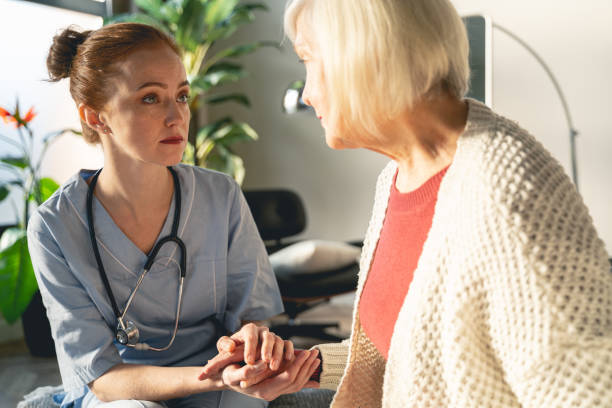 istock Concentrated young doctor supporting her mature patient 1196243761