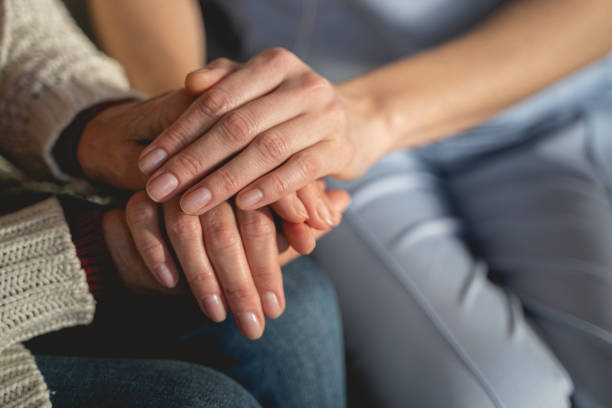 istock Young medical worker supporting her mature patient 1196243811