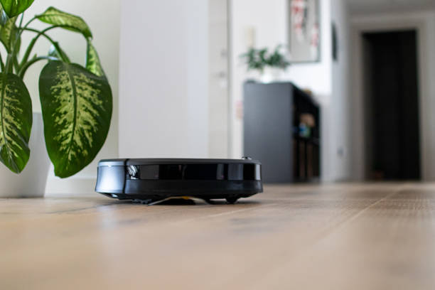Robot vacuum cleaner in a new apartment stock photo