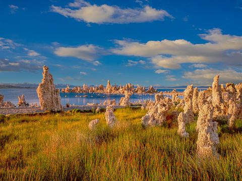 A BLUE SKY WITH SIERRA WAVE CLOUDS ABOVE THE TUFAS AT MONO LAKE SCENIC AREA, LEE VINING, CALIF.
