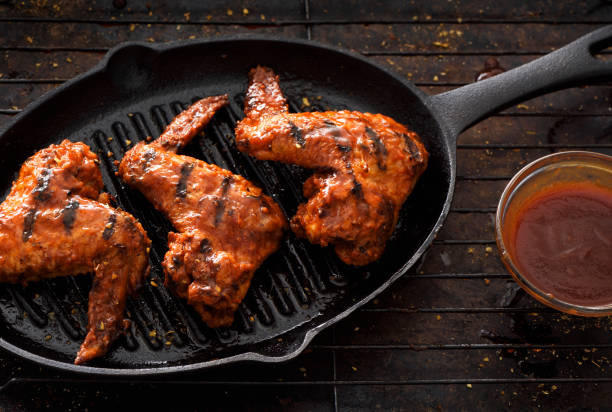 istock Barbecue grilled chicken wings in a griddle 1196254439
