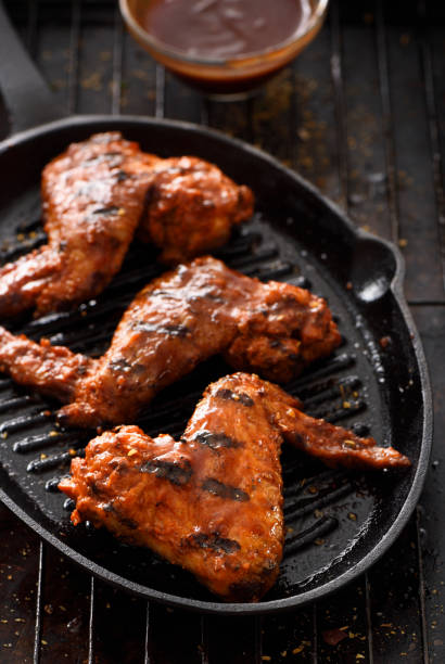 istock Barbecue grilled chicken wings in a griddle 1196254475