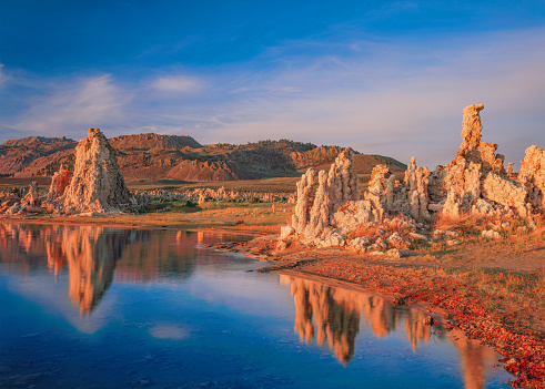 A BLUE SKY WITH CLOUDS ABOVE THE TUFAS AT MONO LAKE SCENIC AREA, LEE VINING, CALIF.