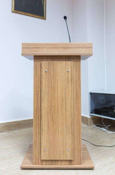 African American man giving a speech at a podium.
