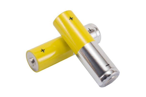 Top view of the background of AAA AA batteries and rechargeable batteries. Choice of batteries. Energy supply and recycling concept. Textures of electric elements packed close together in a box.