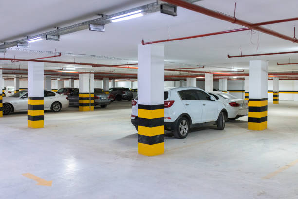 istock Underground parking garage with various cars. 1196258246