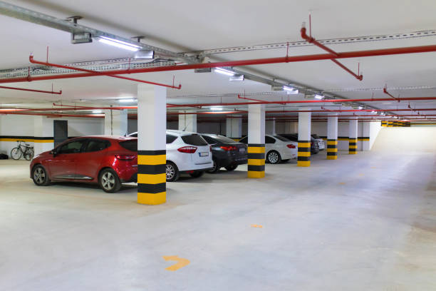 istock Underground parking garage with various cars. 1196258274