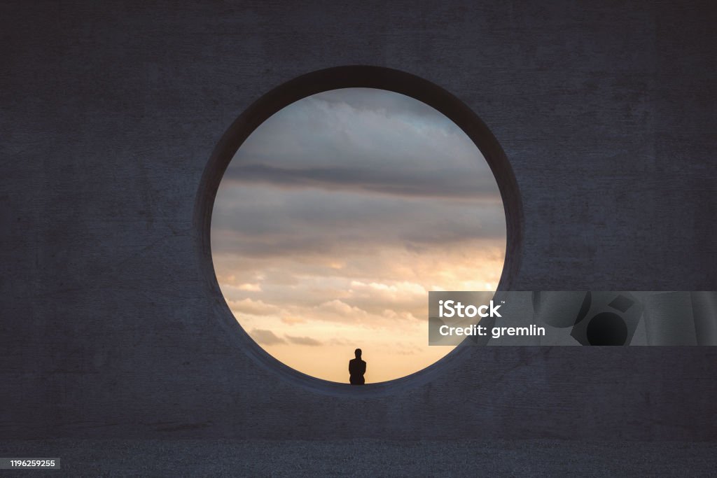 Lonely young woman looking through concrete window Lonely young woman looking through concrete window. This is entirely 3D generated image. Circle Stock Photo