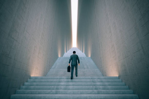 istock Businessman Climbing The Stairs 1196259380