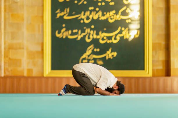 Beautiful Muslim Woman in Hijab Dress in Mosque and Praying