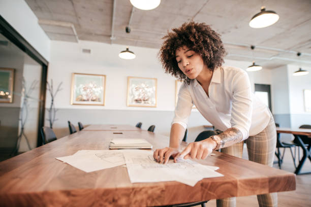 istock Woman working on project in the office 1196263574