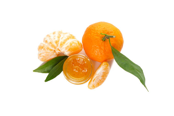 istock Tangerines isolated with green leaves with jam on a white background flat lay. 1196266434