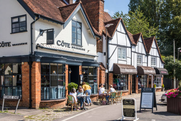 People sat outside the Cote Brasserie Amersham, England - August 22nd 2019: People sat outside the Cote Brasserie and coffee shop. Many people sit outside on sunny days. amersham stock pictures, royalty-free photos & images