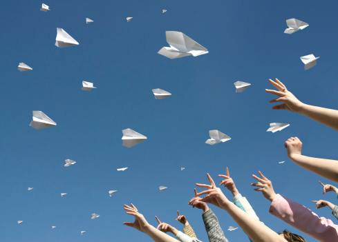 The Hands of children caught the messages in the manner of paper airplanes.